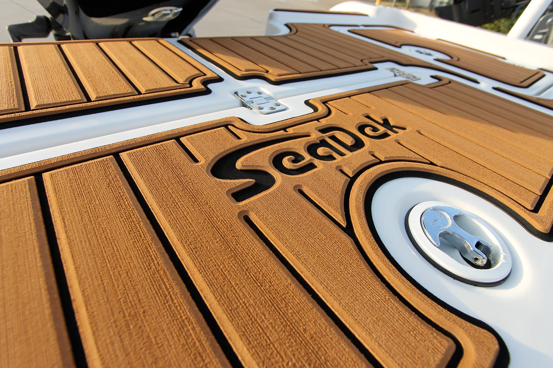 Custom routed SeaDek marine flooring with a detailed SeaDek logo